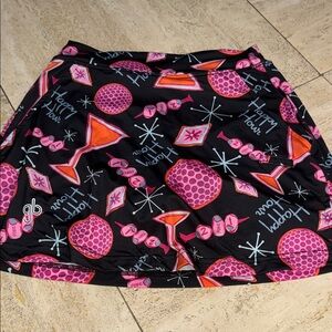 Bella sports skort for golf or raquet sports. Gold ball design